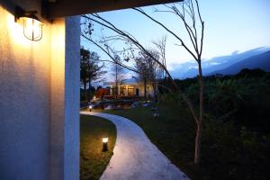 a house with a light on the side of a sidewalk at 太魯閣研海泊別墅 Taroko Yan Hai Bo Villa in Xincheng