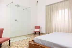 Łóżko lub łóżka w pokoju w obiekcie Villa Aurelia - guesthouse Le Case di Aurelia