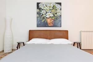 Łóżko lub łóżka w pokoju w obiekcie Villa Aurelia - guesthouse Le Case di Aurelia