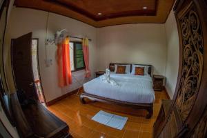Postel nebo postele na pokoji v ubytování El Greco Bungalows Koh Lanta