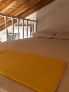 Postel nebo postele na pokoji v ubytování Siora Andromache