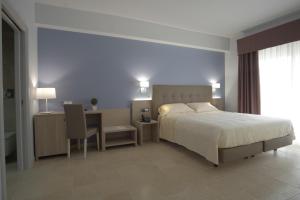 Krevet ili kreveti u jedinici u okviru objekta Netum Hotel