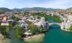 an aerial view of a city with a bridge over a river at Pansion Villa Nur in Mostar