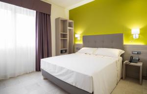 Krevet ili kreveti u jedinici u okviru objekta Netum Hotel