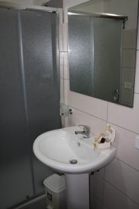a bathroom with a sink and a shower with a mirror at B&B Borgo Pileri in Mazzarino +72 photos