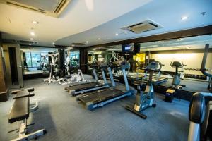 a gym with several treadmills and machines in it at Fortune Park JP Celestial, Bengaluru - Member ITC's Hotel Group in Bangalore