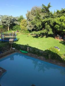 an overhead view of a blue swimming pool in a yard at White Wings in Nuneaton