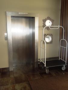 a hospital cart in front of a door at Howard Johnson by Wyndham Atlantic City in Atlantic City