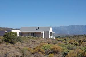 a house on a hill in the desert at Tanagra Wine & Guestfarm in McGregor