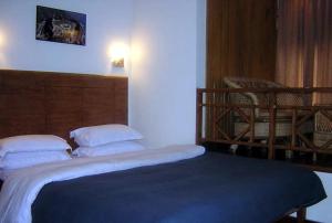 Postel nebo postele na pokoji v ubytování Hotel Shangrila Regency