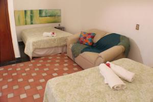 מיטה או מיטות בחדר ב-Casa Madero Rooms