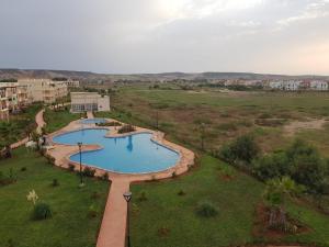 an overhead view of two pools in a field at FamilyConfort Saidia in Saïdia