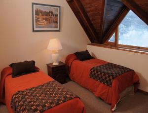 A bed or beds in a room at Village Catedral Hotel & Spa