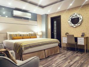 Postel nebo postele na pokoji v ubytování Hotel Ojos Del Rio + 37 fotografií