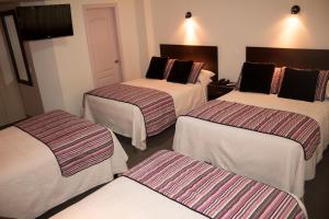 Postel nebo postele na pokoji v ubytování Hotel Novalux
