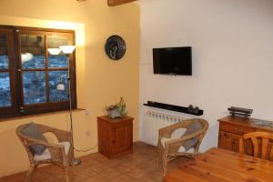 TV a/nebo společenská místnost v ubytování Ca la Nuri