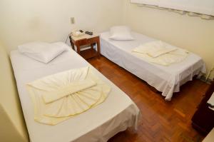 Postel nebo postele na pokoji v ubytování Hotel Indaiá