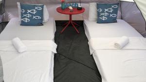 Uma cama ou camas num quarto em Camping@La Jamaca