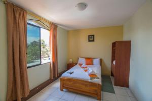 Postel nebo postele na pokoji v ubytování Hostal Andry + 37 fotografií