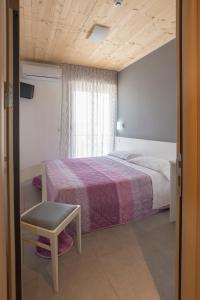 Postel nebo postele na pokoji v ubytování Hotel Atene