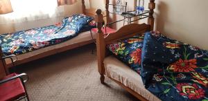 a bedroom with two bunk beds with colorful blankets at Roadway in Kielce