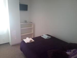 Postel nebo postele na pokoji v ubytování Apartmány Karlštejn
