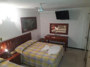 Ένα ή περισσότερα κρεβάτια σε δωμάτιο στο Hotel Maria Luisa +18 φωτογραφίες