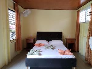 A bed or beds in a room at Sea n sun Guest House