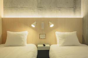 Postel nebo postele na pokoji v ubytování DOMO Hotel