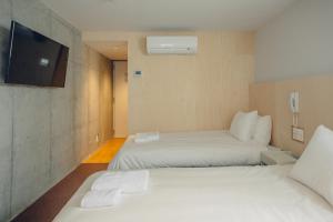 Postel nebo postele na pokoji v ubytování DOMO Hotel