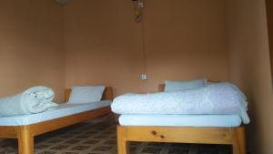 Postel nebo postele na pokoji v ubytování peace guesthouse cottage