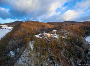 an aerial view of a house on top of a mountain at Castello di Brandola in Polinago