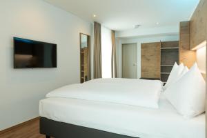 Katil atau katil-katil dalam bilik di TRIP INN JET HOTEL Zürich Airport
