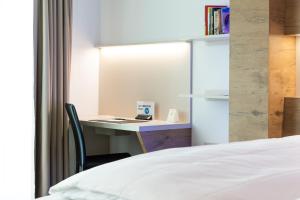 Katil atau katil-katil dalam bilik di TRIP INN JET HOTEL Zürich Airport