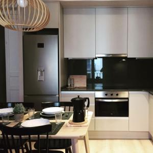 a kitchen with a table with a tea kettle on it at 555 Apartments BCN in Barcelona