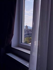 a window with a view of a city at Hotel Beni in Akhaltsikhe