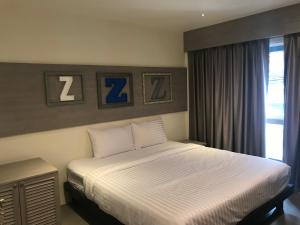 מיטה או מיטות בחדר ב-Lazy Sunday hostel