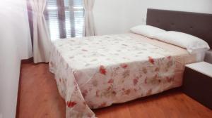 Posteľ alebo postele v izbe v ubytovaní Apartamento Santa Faz