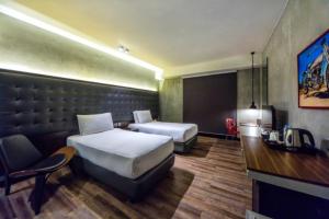 Letto o letti in una camera di The B Hotel Quezon City