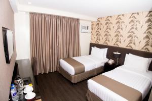 Postel nebo postele na pokoji v ubytování GT Hotel Iloilo + 27 fotografií