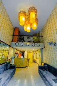 a lobby with a chandelier and a waiting room at A25 Hotel - 53 Tuệ Tĩnh in Hanoi