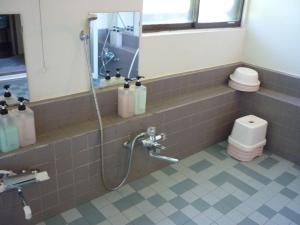 a bathroom with a shower and a toilet at Stayful House Nakamachi in Hakuba +43 photos