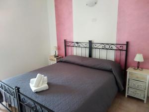 Postel nebo postele na pokoji v ubytování B & B Pietra Vecchia