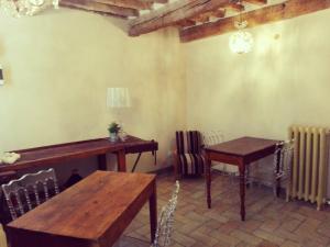 a room with a table and a table and chairs at Tambien B&B in Pesaro