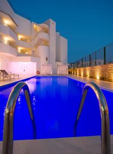 a large swimming pool in a large building at My Way Luxury Ibiza Studio - AB Group in Playa d'en Bossa