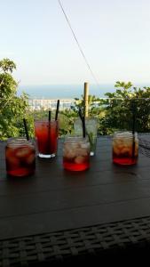 a group of glasses of drinks sitting on a table at Agriturismo Fattoria Montecontessa in Genoa