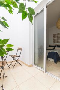 a room with a sliding glass door leading to a bedroom at Apartamento Good Morning Velvet in Vecindario