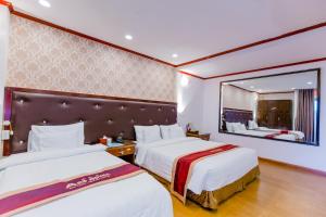 Säng eller sängar i ett rum på A25 Hotel - 46 Châu Long