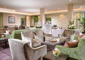 a living room filled with furniture and decor at Actons Hotel Kinsale in Kinsale