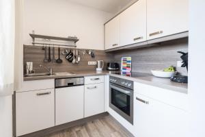 Kuchyň nebo kuchyňský kout v ubytování Ferienapartment Fuchsfarm
